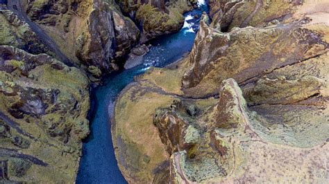 Deep Fjadrargljufur Canyon And River Flowing Along The Bottom Of The