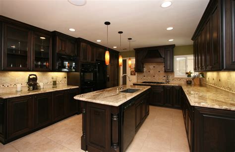 Cute dark brown color mahogany wood kitchen cabinets comes with silver color long shape metal cabinet door handles and black color granite countertops. 47 Amazing Kitchen Design Ideas - You'll Beg To Call Your ...