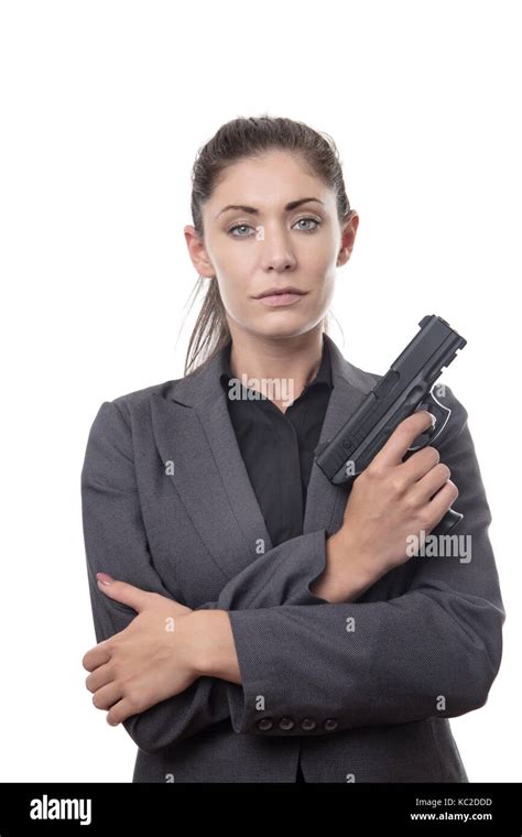 Business Woman Holding A Gun Looking At Camera Stock Photo Alamy