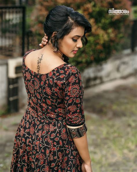 Sithara Krishnakumar Latest Tattoo In Back Side Photos Photos Hd Images Pictures Stills