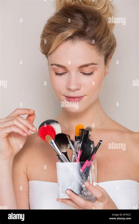 Beautiful Woman Holding Assorted Makeup Brushes Stock Photo Alamy