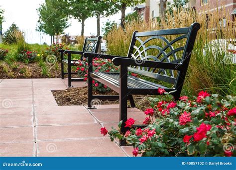 Two Black Benches In A Roadside Park Stock Photo Image Of Brick