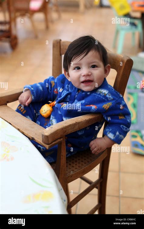 Its A Photo Of A Chinese Eurasian Mix Baby In An Old Style Baby Chair