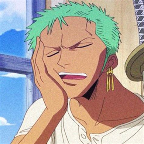 An Anime Character With Green Hair Holding His Hand To His Face