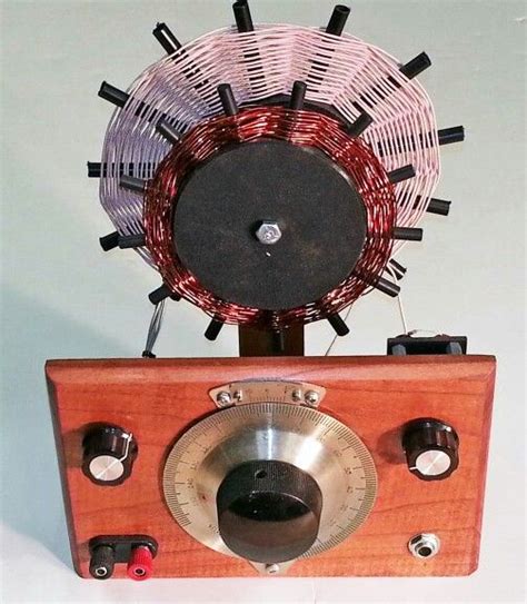 An Old Fashioned Radio Sitting On Top Of A Wooden Stand With Wires
