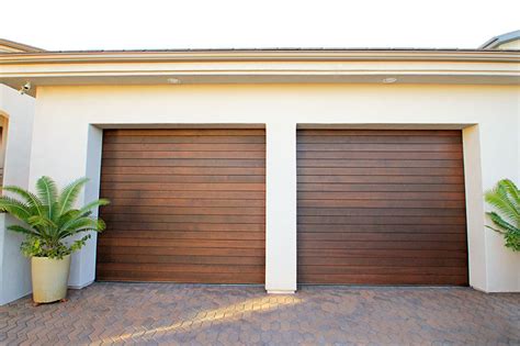 There is no question that a wood garage door will add a tremendous curb appeal to a home. Stain Grade Custom Wood Garage Doors | Garage Doors Unlimited