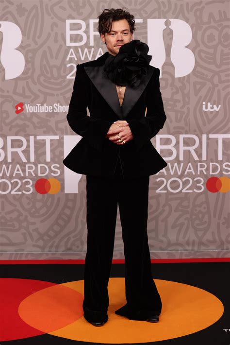 Harry Styles Corsage Was The Star Of The Brit Awards Red Carpet