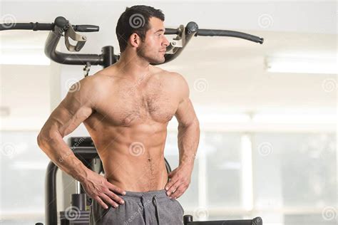 Hairy Muscular Man Flexing Muscles In Gym Stock Photo Image Of