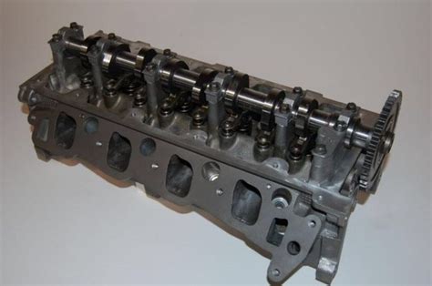 A gasoline combustion engine with two cam shafts located above each row of cylinder heads. What is the difference between SOHC and DOHC in automotive ...