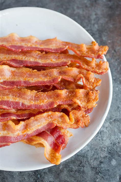 Our oven is very basic with many hot spots, so i do start checking on it at 15 minutes and rotate the pan. Perfect Oven Baked Bacon | Brown Eyed Baker