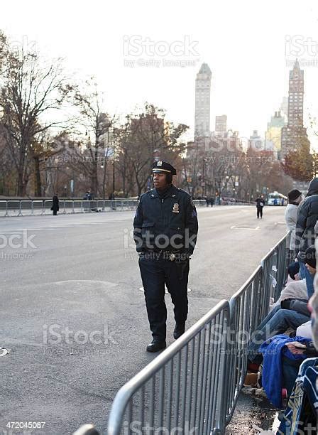 Young Police Officer Walking Down 2013 Macys Parade Route Stock Photo