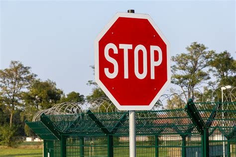 German Stop Sign On Barb Wire Fence Stock Photo Download Image Now