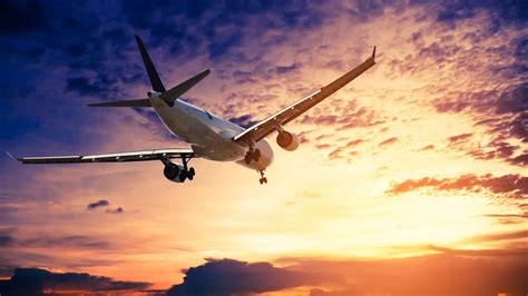 Airplane In The Sunset Sky Flight Travel Transport Airline Background