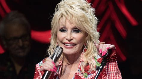 why does dolly parton wear gloves or long sleeves the us sun