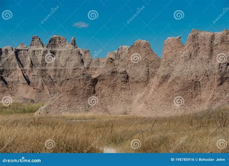 Layered Rock Formations Steep Canyons And Towering Spires Of Badlands
