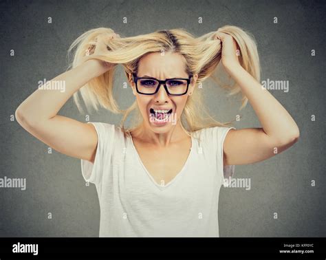 Angry Woman Screaming Out Loud And Pulling Her Hair Out Isolated On
