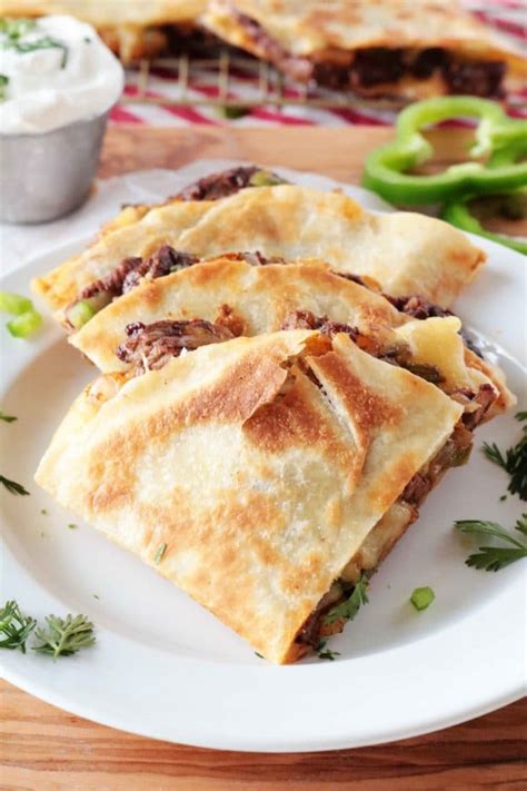 Lay 4 tortillas on a baking sheet and top each with beef mixture and cheddar . Steak Quesadillas - The Anthony Kitchen