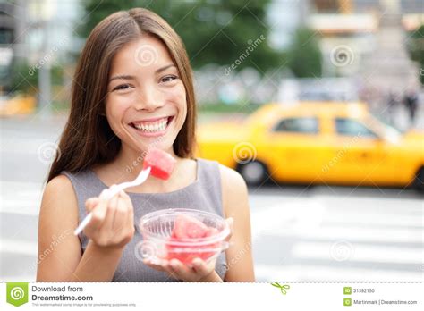 Business Woman In New York Eating Watermelon Snack Stock