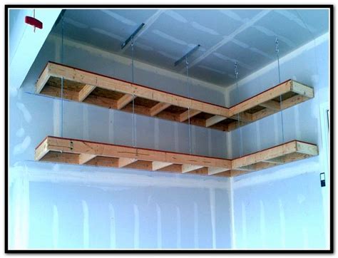 How about creating a suspended, sliding storage system where you could keep all your tools and other goodies? Diy Overhead Garage Storage Racks | Diy overhead garage ...