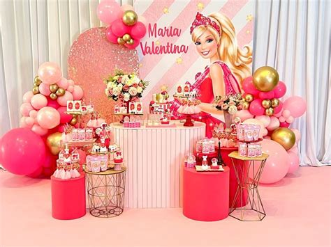 A Barbie Birthday Party With Pink And Gold Decorations Balloons And