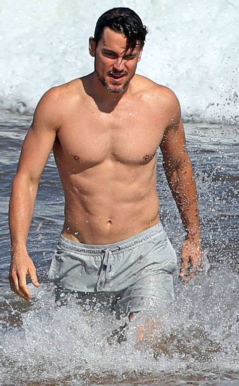 the actor makes his way through the crashing waves with his toned and tanned body while