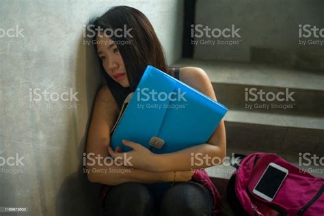 Dramatic Portrait Of Asian Female College Student Bullied Young