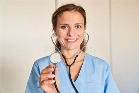 Young Woman As A Friendly Doctor With Stethoscope Stock Image Image