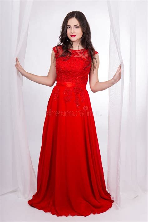 Full Length Portrait Of Beautiful Woman In Red Dress Stock Photo