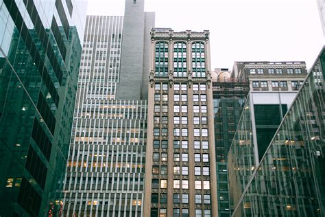 Contemporary Skyscraper Facades Reflecting Sky In City · Free Stock Photo