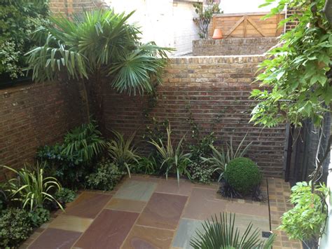 The large windows of the house also offer a wonderful view to the. Low Maintenance garden designs - Garden Club London