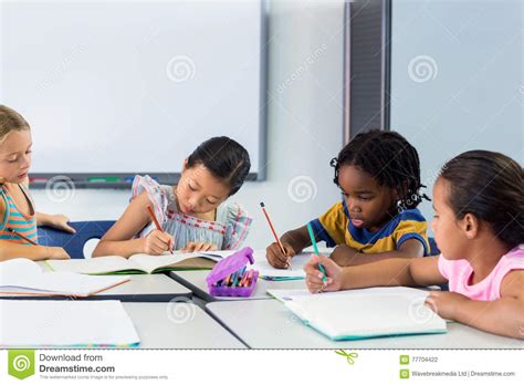 Schoolchildren Writing On Books Stock Photo Image Of Learn Caucasian