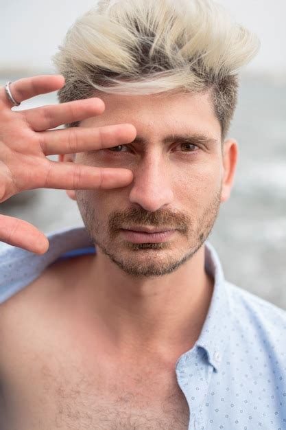 Premium Photo Portrait Of A Blond Caucasian Guy With His Hand On His