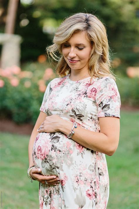 Beautiful Woman In A Dress With Holding Her Pregnant Belly By Stocksy