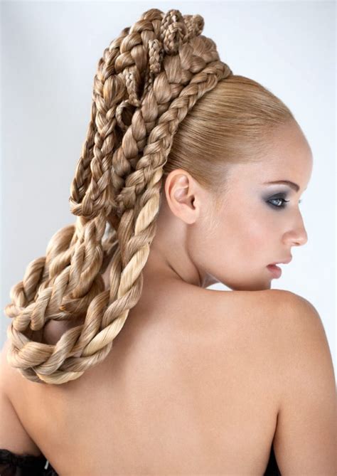 Straight hair sticks straight out. Layered braids of all sizes wrapped in loops around the ...
