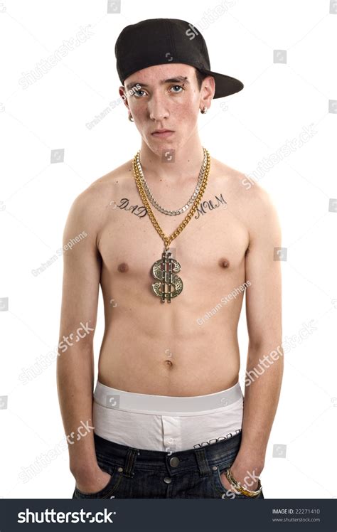 Portrait Of A Teen Youth With Top Off Showing Tattoos And