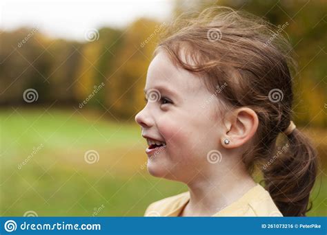 Lovely Cute Red Haired Little Girl In The Autumn Park Outdoors Lovely