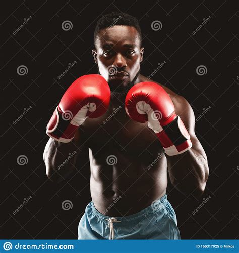 Portrait Of Confident African Boxer Standing In Ready Pose Stock Image