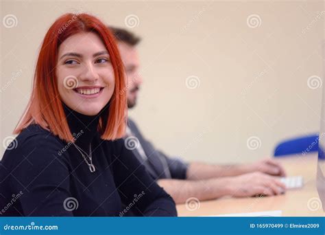 Happy Young Female Student Smiling Into Camera During Comp Lab Class
