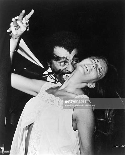 American Actor William Marshall As A Vampire Bites Into A Womans