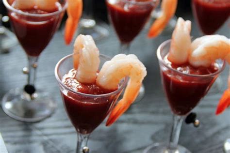 Simply fill the bottoms of shot glasses with prepared cocktail sauce and drape a few cooked shrimp over the edge. 27 Unexpected Cocktail Hour Hors d'Oeuvres Slideshow