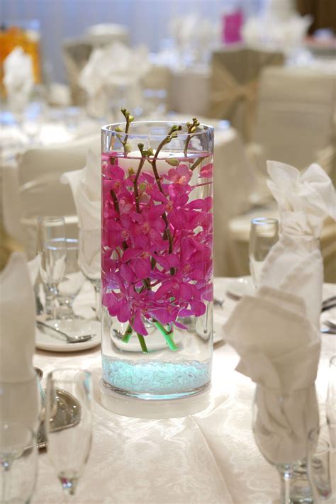 So, we suggest planning your wedding rehearsal dinner to celebrate the season—but with a creative theme to style your table settings around.here are more than 10 fall dinner themes we found to inspire you, whether you plan an al fresco gathering or one in a barn, country cottage, restaurant, or right in your home. Centerpiece | Glass cylinder vases, Cylinder vase ...