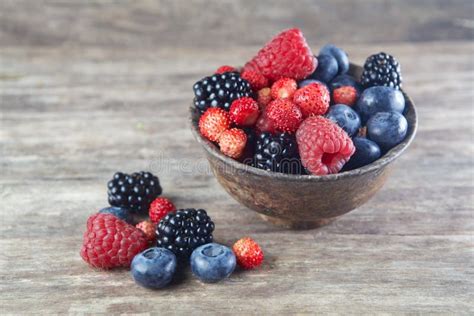 Assorted Berries In Bowl On Wood Stock Photo Image Of Glass