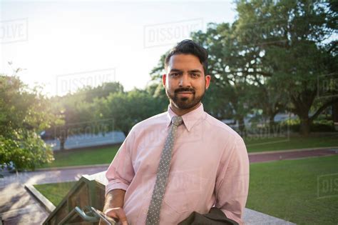Indian Businessman Smiling On Steps Stock Photo Dissolve
