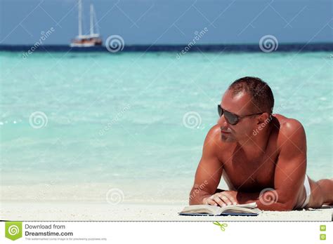 Handsome Man Reading Book At The White Sand Beach Stock Photo Image Of Scenic Enjoy