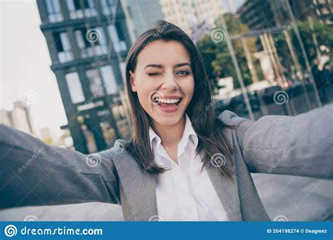 Photo Of Happy Cheerful Attractive Young Businesswoman Take Selfie Wink