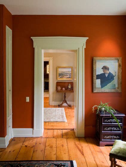 Muted shades of blue or green appear natural and organic, balancing the warmth of the brown with a cool background. rustic wood floor / door molding / contrasted colors ...