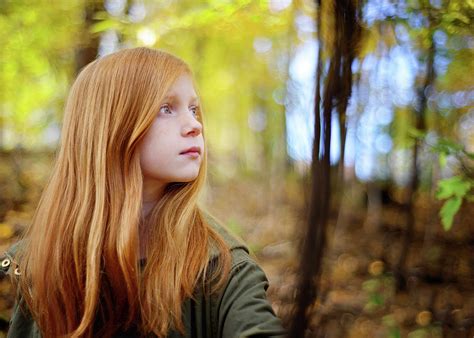 Beautiful Red Haired Girl In The Woods Photograph By Cavan Images