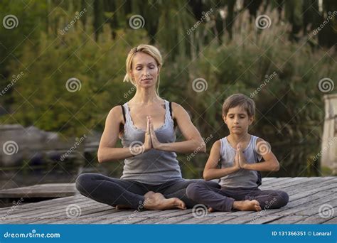 Mother And Son Exercising Yoga Pose Stock Image Image Of Relaxation Cheerful