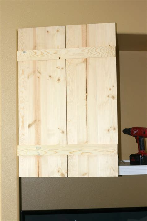 Western barn door with homemade hinge made out from old horseshoes. Finley Gray: Diy Barn Cabinet Doors