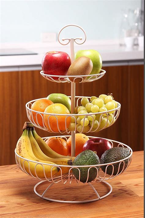 Three Tiered Fruit Tray With Apples Bananas And Avocados